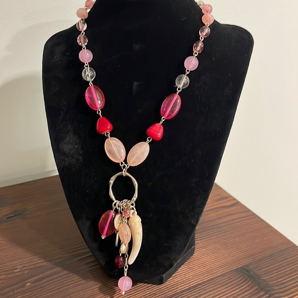 Pink beaded charm necklace with stone horn of wealth and silver tone accents